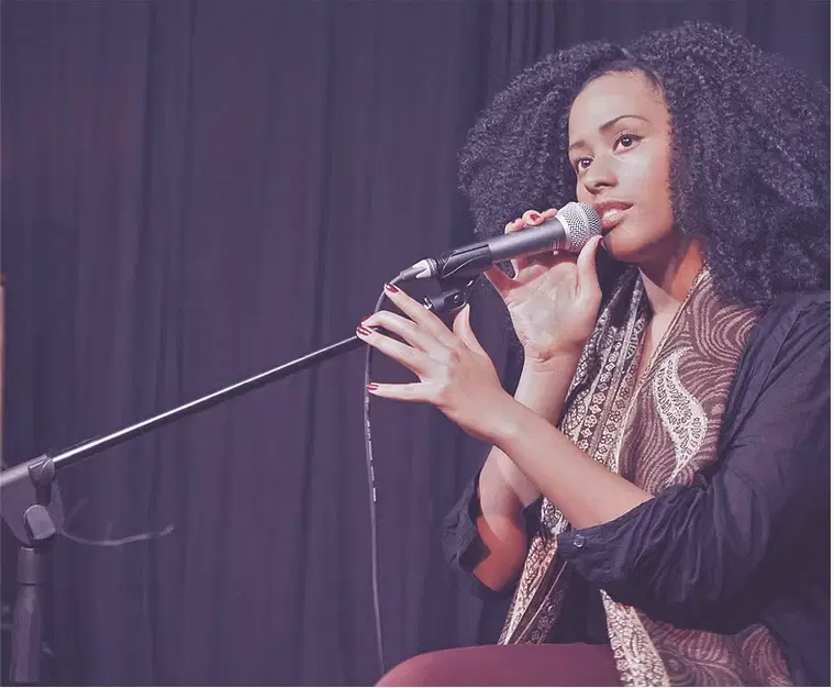 A singer practising with a microphone