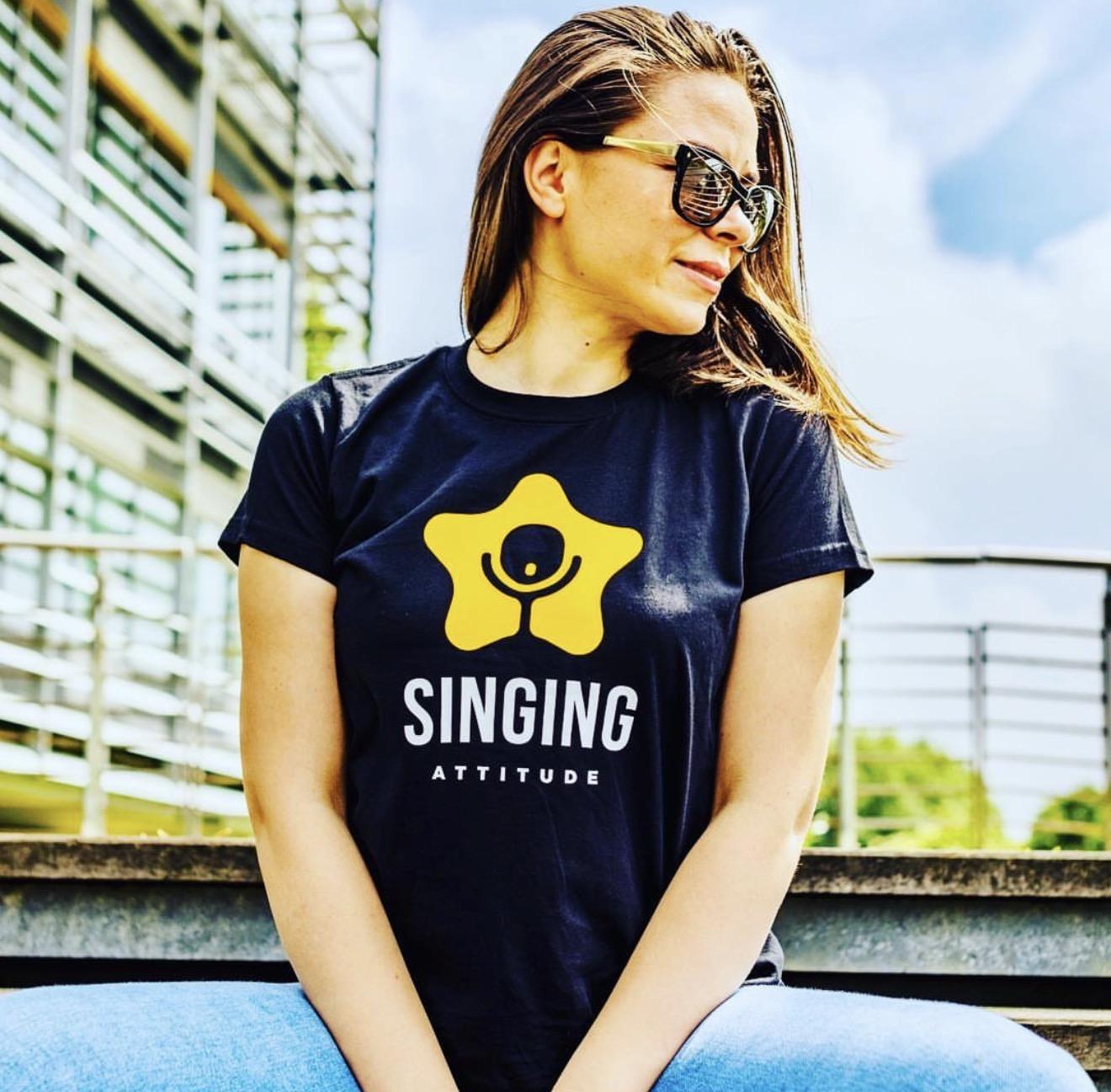 Liuba Doga wearing a Singing Attitude shirt